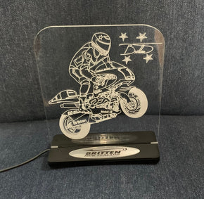 Edge lit action picture display on stand